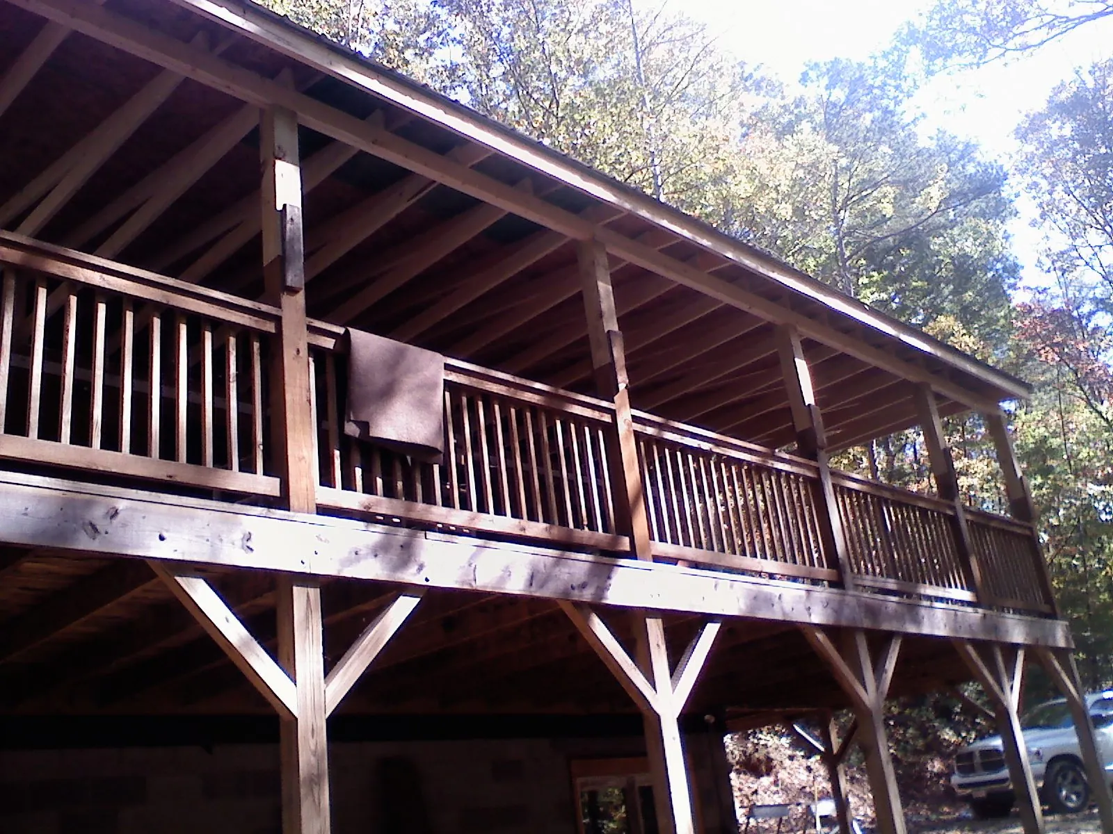 Timber framing under a new elevated porch and deck — Roof Leak Repair in Geneseo by Roofing Brothers